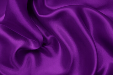 Dark purple fabric texture background, detail of silk or linen pattern.