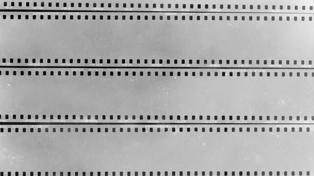 Vintage Film Negative Loop.Looping black and white 35mm film strips. Features scratches, grain, and sprocket holes for a retro cinematic background or overlay texture.