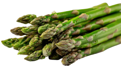 Fresh green asparagus spears clustered together, isolated on black