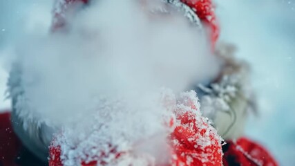 Child's breath visible in freezing winter air, with frost on red jacket.