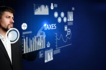 Businessman interacts with digital tax data on touchscreen display in modern office environment
