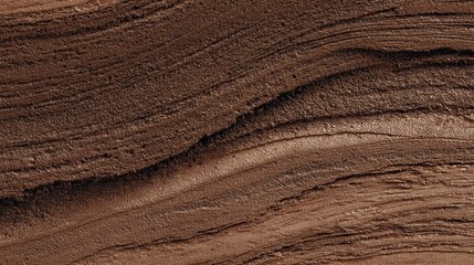 茶色のでこぼこした石の背景画像