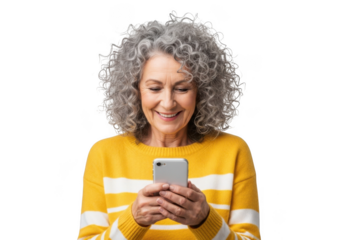 Smiling mature woman with curly gray hair wearing a yellow and white striped sweater holding a smartphone isolated on transparent background