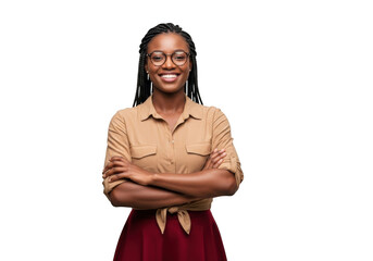 Naklejka premium Smiling young african american woman with braided hair wearing glasses and a tan shirt with arms crossed isolated on transparent background