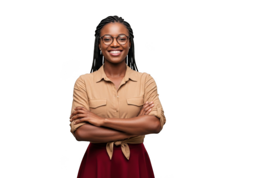 Smiling young african american woman with braided hair wearing glasses and a tan shirt with arms crossed isolated on transparent background