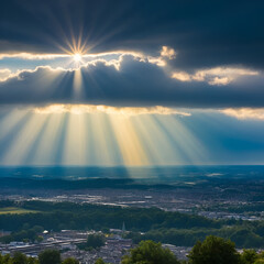 Strong sunrays reaching behind clouds to town