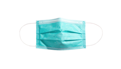 Light blue surgical mask with elastic straps on a black background, laying flat