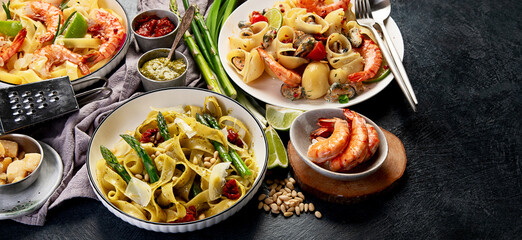 Italian dinner table with assortment of pastas.