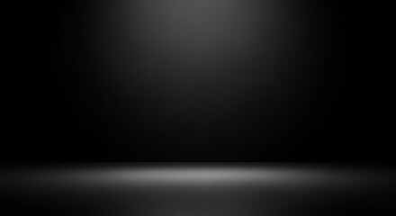 Dark empty studio room background with a soft spotlight for product presentation.