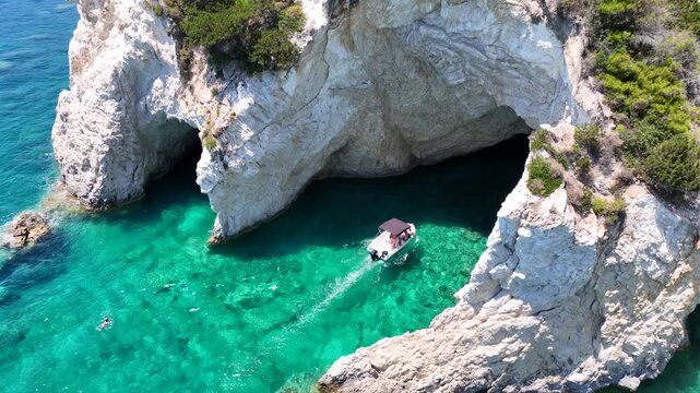 Aerial drone video of scenic turquoise beaches and white rock formations near small port of Porto Vromi an ideal place to start a boat tour near amazing North Zakinthos island, Ionian, Greece