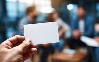 Blank card hand business opportunity teamwork office blurred group people meeting professional creative workspace communication concept planning collaboration modern casual brainstorming success