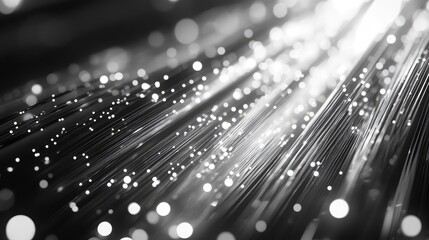 Fiber optic cables transmitting light in abstract network