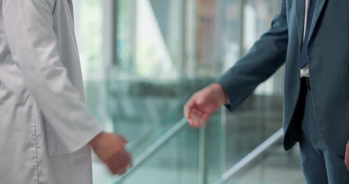Handshake, greeting and doctors in hospital for partnership, welcome or agreement on treatment plan. Shaking hands, healthcare and surgeons in clinic with collaboration, teamwork or medical deal.