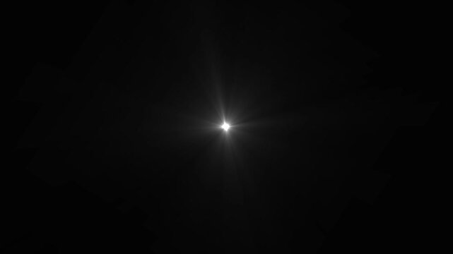 Single bright white starburst lens flare in the center of a black background light