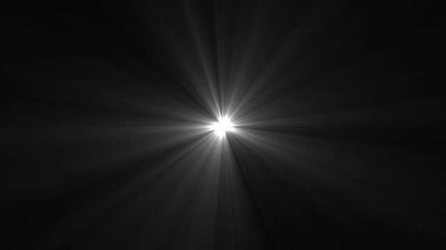 Intense white starburst light emanating from the center on a dark background bright