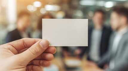 Blank card hand business opportunity teamwork office blurred group people meeting professional creative workspace communication concept planning collaboration modern casual brainstorming success