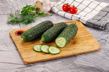 Raw green cucumbers with slices