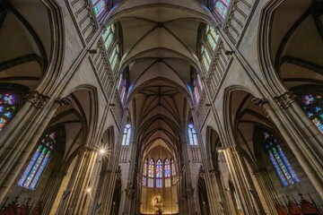 Fototapeta premium Neo-Gothic Cathedral Interior with Vaulted Ceilings and Stained Glass Windows, Good Shepherd (Buen Pastor)