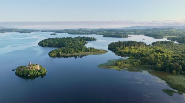 Aerial drone view of McDermotts Castle on small island in Lough Key lake, county Leitrim, Ireland. 4K drone footage