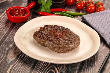 Grilled beef burger cutlet with sauce