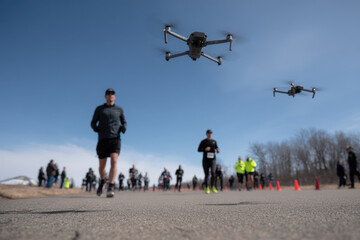 swarm of ultrabright drones accompanies marathon runners monitoring their physical conditions during race