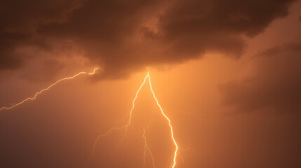 Powerful yellow lightning bolt strikes through stormy dark clouds in night sky. Dramatic natural phenomenon, raw energy discharge, intense weather event. Thunderstorm, rainstorm, electric flash,