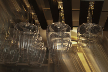 Restaurant life in the reflection of glassware