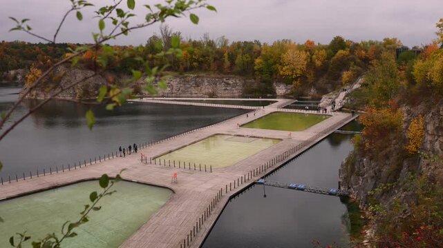 Quarry with boardwalks and autumn foliage. Zakrzowek, Krakow