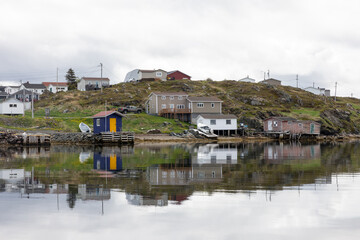 Fototapeta premium Colorful Coastal Village By The Water With Reflections