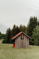 Wooden Cabin with Red Roof in a Meadow, Allgäu Alps