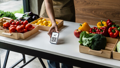 Fresh vegetable market table with colorful produce and person placing QR code payment sign, promoting convenient digital transactions and healthy food choices
