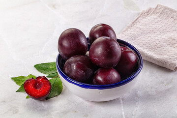 Raw ripe purple plum heap