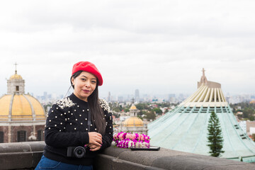 Portrait of a Woman Tourist with Basilica of Our Lady of Guadalupe in Mexico City in background