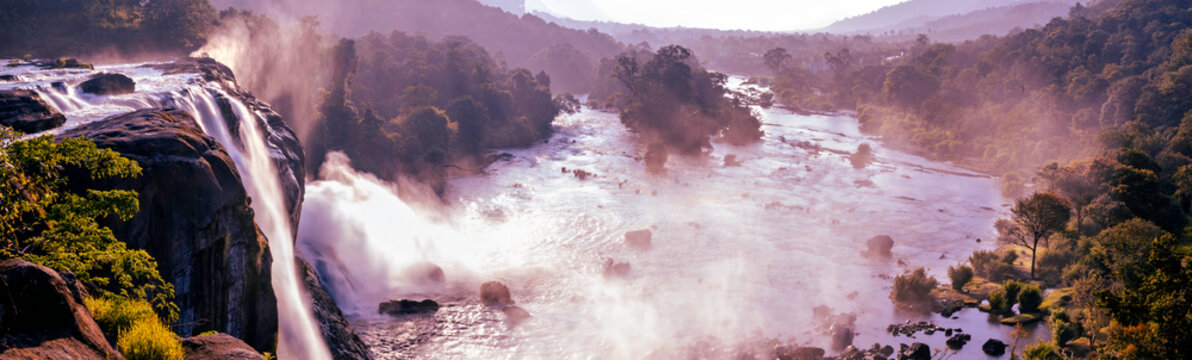 Majestic Athirappilly Falls Panorama in Kerala, India. A  panoramic view of the majestic Athirappilly Falls, called 'The Niagara of India,' located in the lush rainforests of Kerala's Western Ghats.