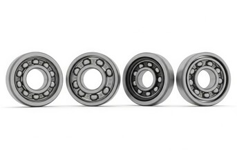 Four ball bearings lined up isolated on white background