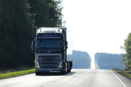 Volvo FH Freight Truck on Road on a Hazy Summer Morning. Copy Space. 