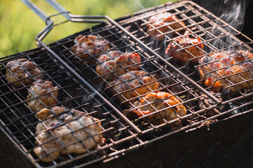 Grilled chicken thighs with a golden brown crust - meat barbecue