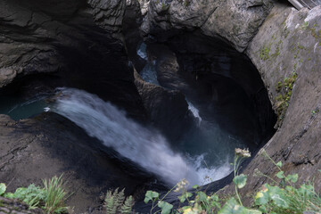 Trummelbach falls water cascading through a deep glacial canyon