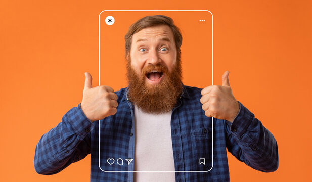 A joyful man with a thick beard smiles widely while giving thumbs up. He stands in front of a vibrant orange backdrop, creating an energetic and inviting atmosphere for social media sharing.
