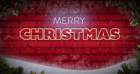 Glowing large MERRY CHRISTMAS sign shining on red brick backdrop, showing falling snow, holly