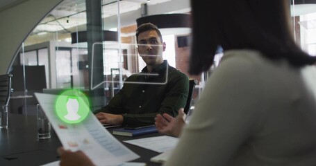Reviewing resume with green profile icon, man in dark-green shirt listening in office, speech UI
