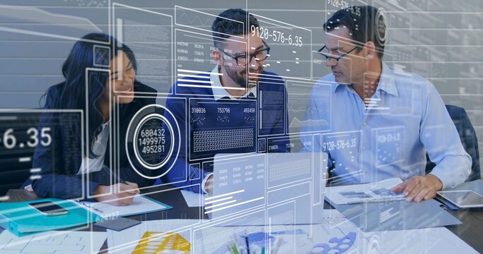 Leaning three colleagues wearing blazers, examining laptop and charts in meeting room, HUD overlay