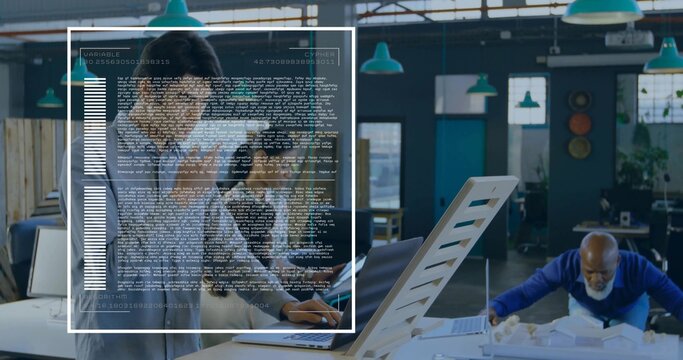 Standing man wearing suit and tie interacting with laptop in design studio, HUD overlay and model