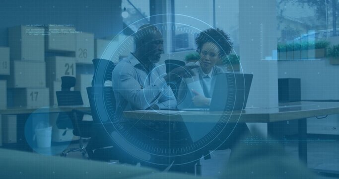 Talking two coworkers in business attire pointing at laptop and docs at office, numbered boxes HUD