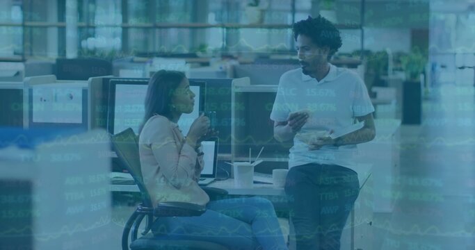 Talking two coworkers wearing business-casual at open office, with laptop and coffee, data overlay