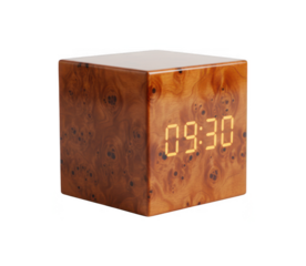 Modern wood burl cube digital alarm clock displaying 09:30 with warm light