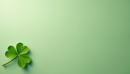 Naklejka premium Close-up of vibrant green four-leaf clover resting on pale sage background. Image offers ample negative space for design applications. Evokes themes of luck, springtime, good fortune. Stock photo
