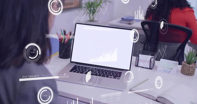 Businesswoman leaning toward laptop while blank screen causing HUD charts animating over desk