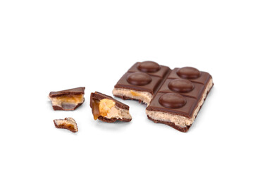 Chocolate bar with caramel, nougat and nuts filling isolated on white background.