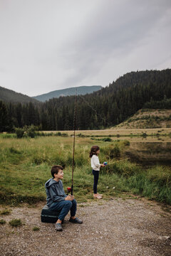 Children Fishing by a Mountain Lake